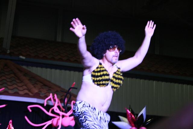 Lynette George / Herald Democrat This proud, bra-clad model gets the crowd to its feet at Bras for a Cause Saturday evening.